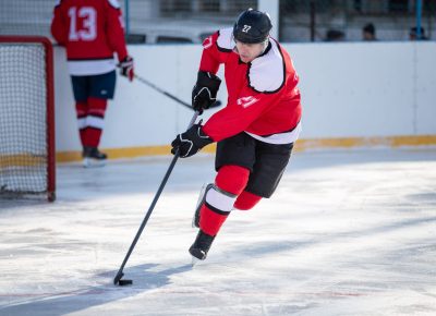 Professional ice hockey player in attack on the rink.